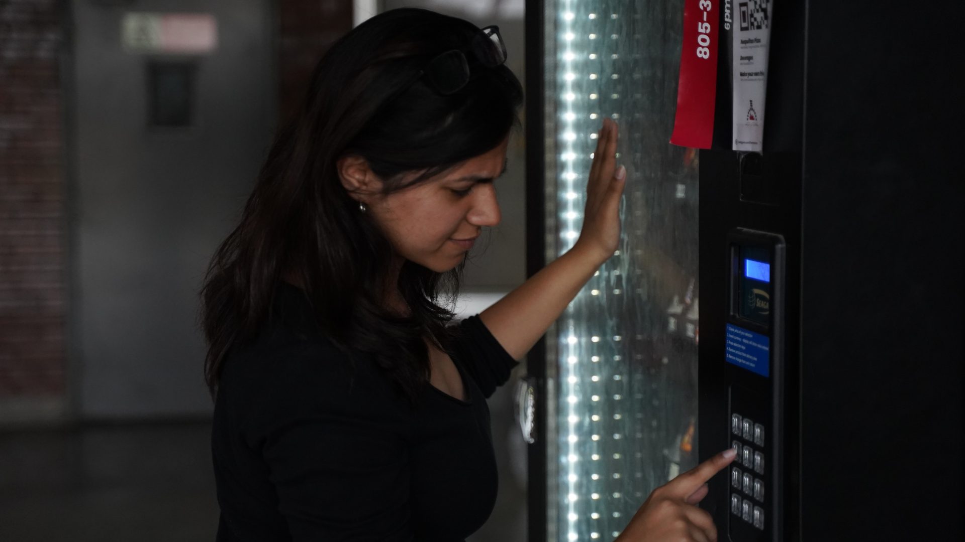 Person using a vending machine